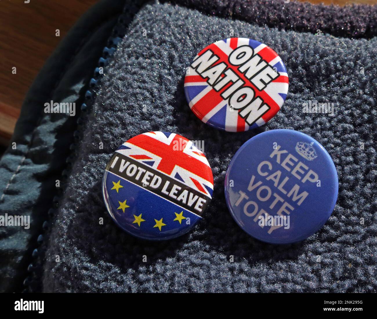 Badges on a Tory voter jacket - Will Brexit Leavers keep calm and vote Tory for one nation ? Stock Photo