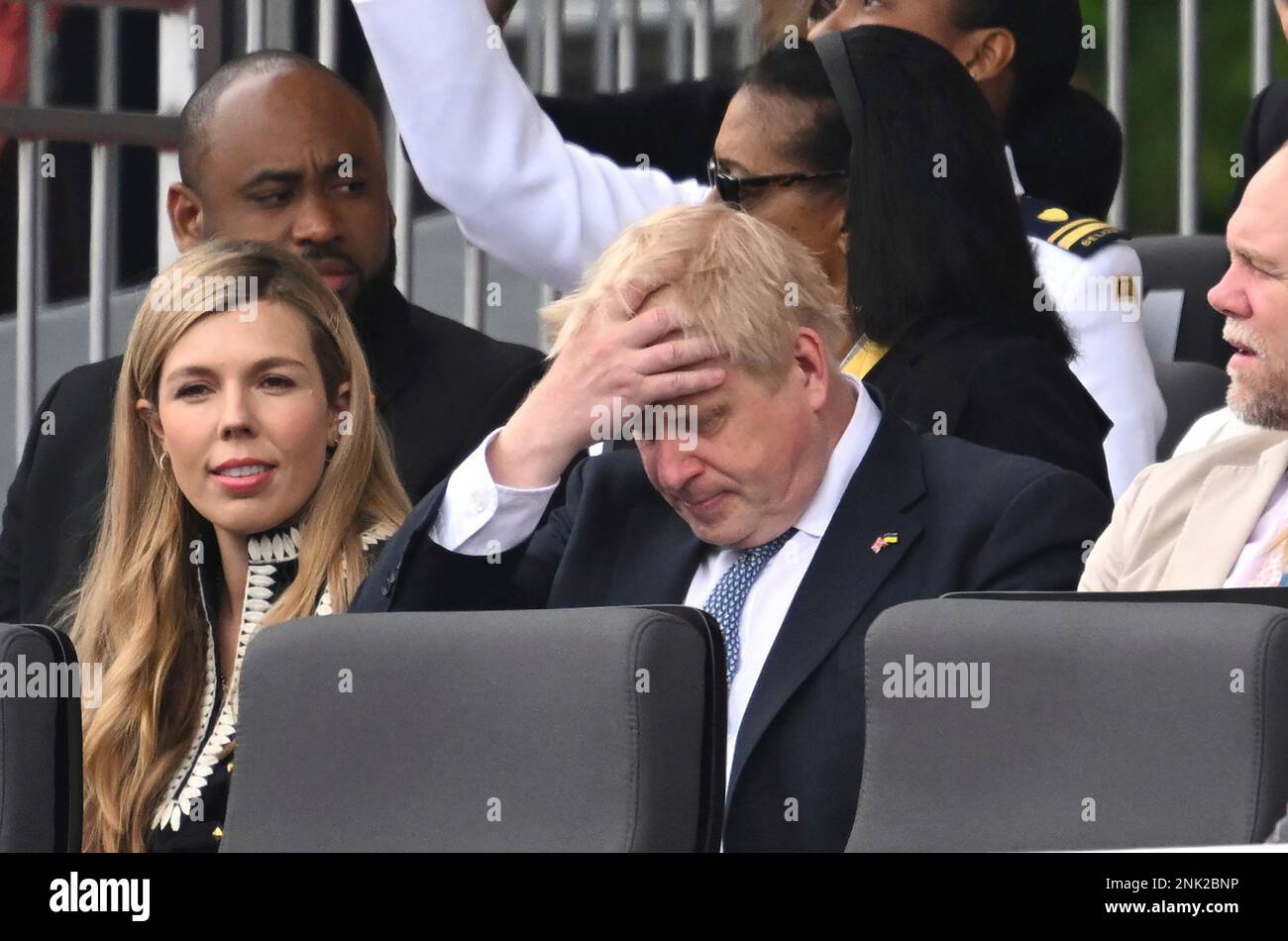 Britain's Prime Minister Boris Johnson and his wife Carrie, are seated