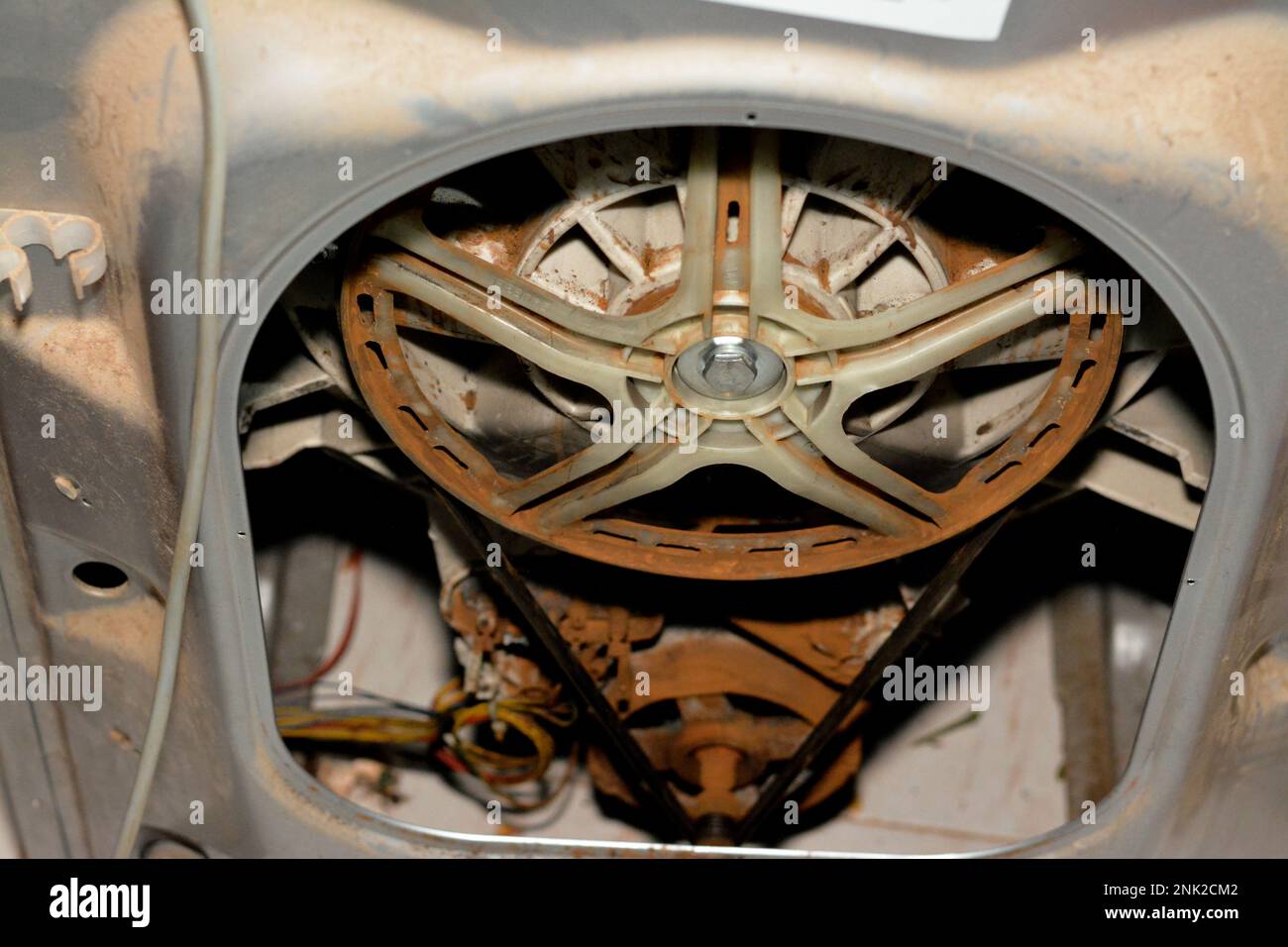 Rusty old dirty automatic electric washing machine drum that is
