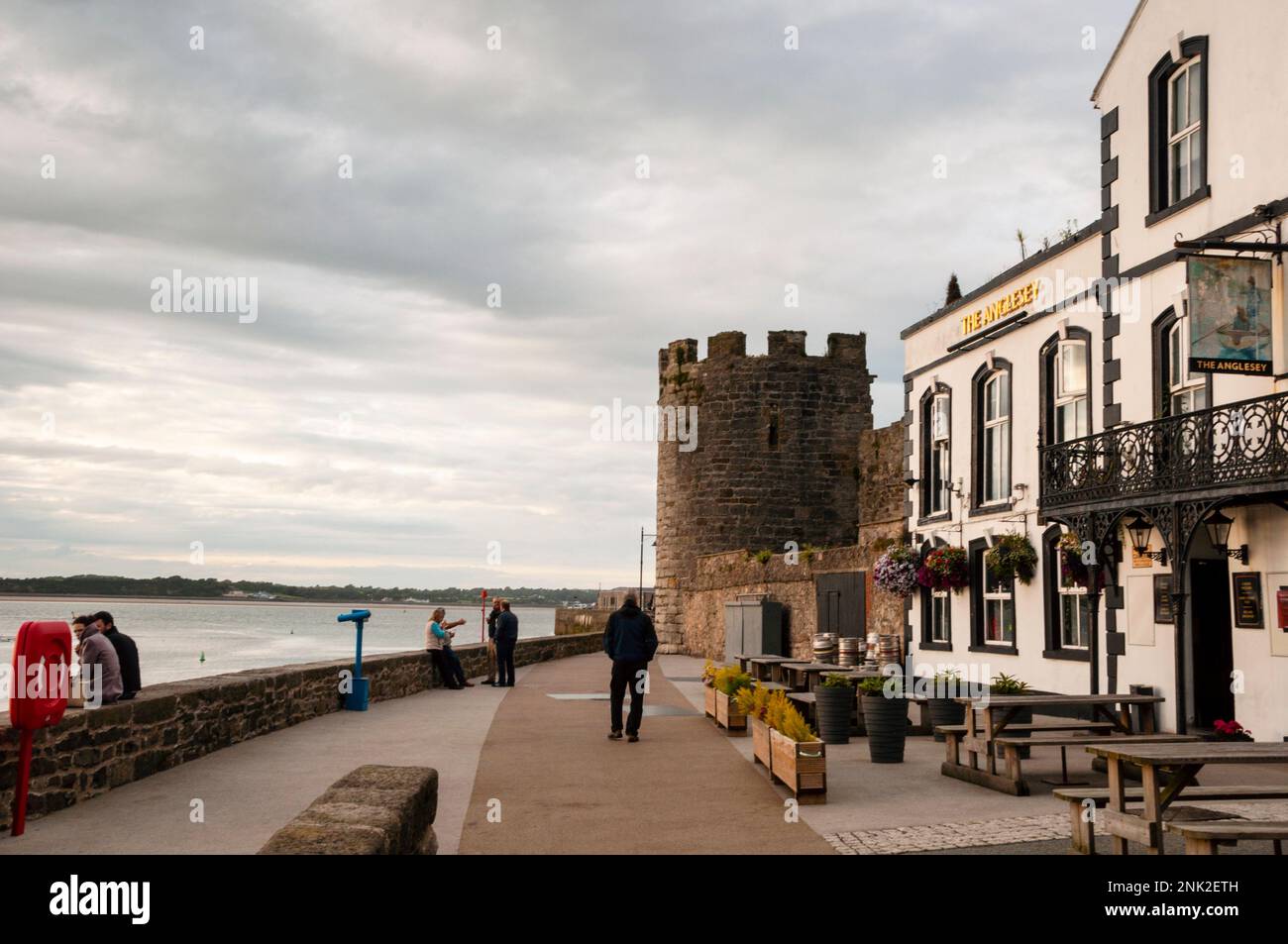Round tower, town walls and quay of Edwardian Caernarfon Castle in the