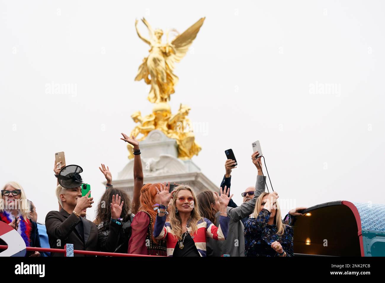 Kate Moss waves during the Platinum Jubilee Pageant outside the