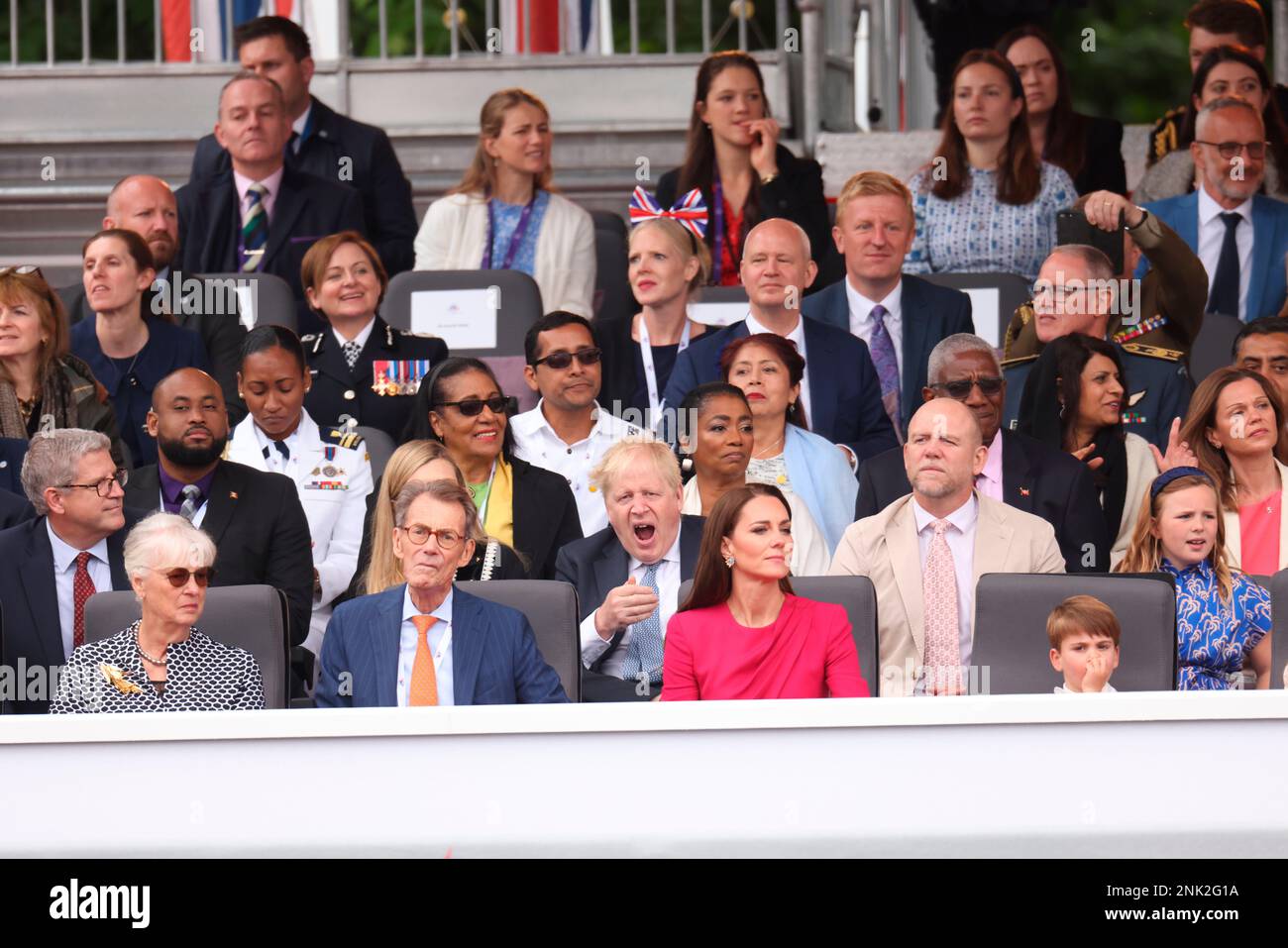 Britain's Prime Minister Boris Johnson, below center, yawns in the