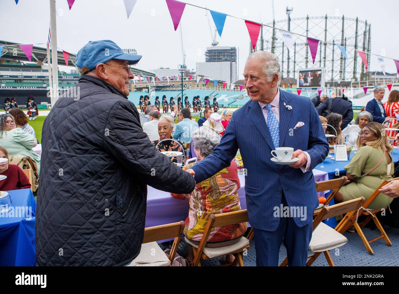 Britain's Prince Charles, right, as Patron of the Big Lunch, attends a