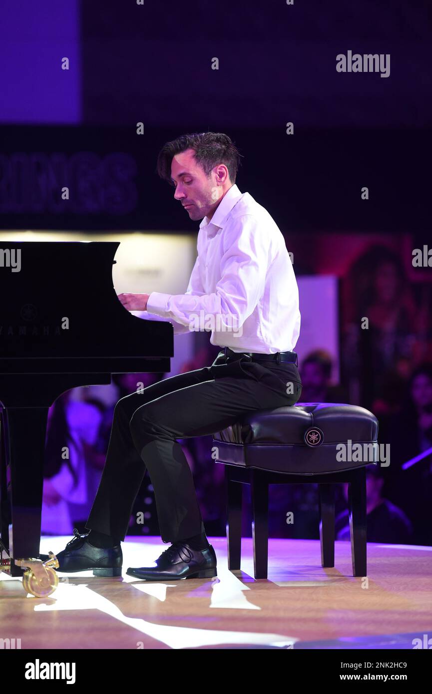 ANAHEIM, CA - JUNE 04: Artist and composer Alfonso Peduto performs on the  piano at the Yamaha booth during the NAMM Show on June 04, 2022, at the  Anaheim Convention Center in
