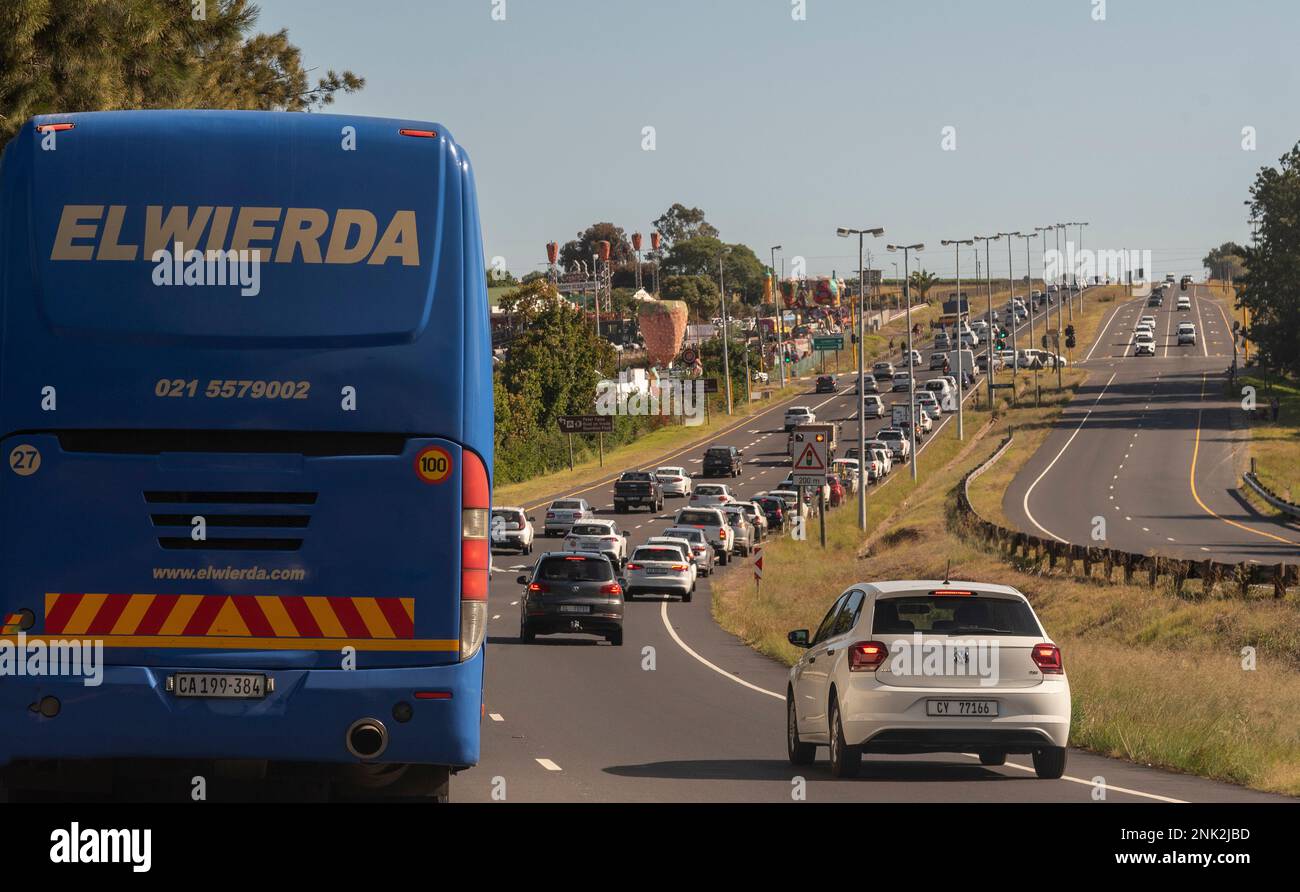 Stellenbosch, Western Cape, South Africa. 2023. Blue public bus standing in a traffic holdup. Stock Photo