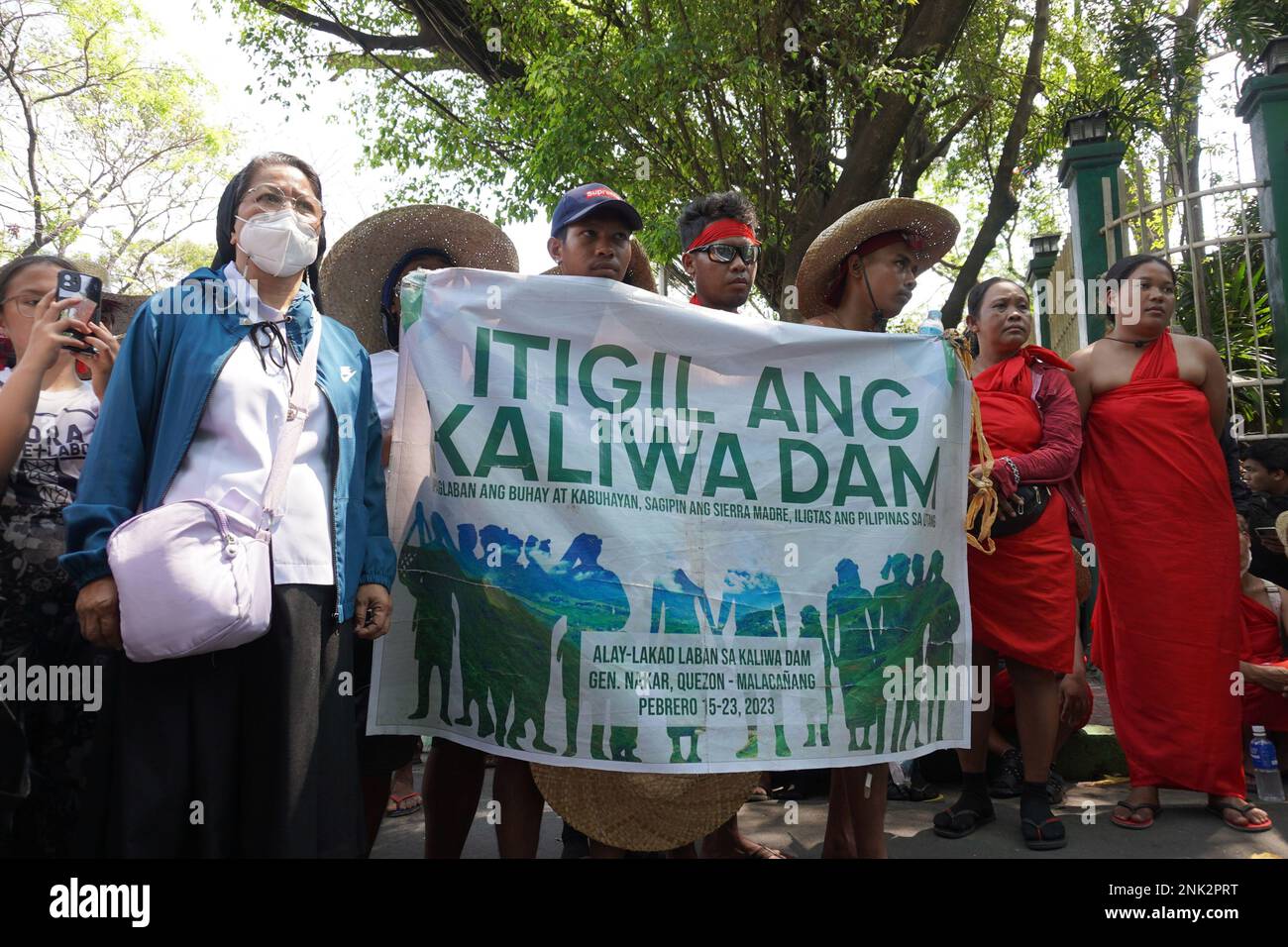 Quezon City, Philippines. 23rh February, 2023. Around 300 indigenous people (IP) belonging to Dumagat-Remontado tribe, together with environmental groups and advocates culminates their 150 kilometers “Alay Lakad Laban sa Kaliwa Dam” (Sacrifice Walk Against the Construction of Kaliwa Dam) going to Malacanang Palace on February 23, 2023. The nine-day sacrificial walk is portraying their opposition on the construction of the New Centennial Water Source–Kaliwa Dam Project (NWCP-KDP), in the borders of Rizal and Quezon Province. The mega-dam project will be submerging almost hundred hectares of anc Stock Photo