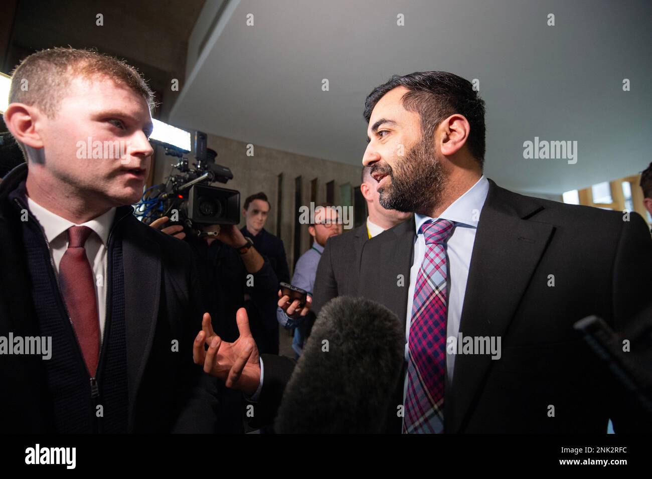 Edinburgh, Scotland, UK. 23rd Feb, 2023. PICTURED: Humza Yousaf MSP, Scottish Cabinet Health Minister, seen interviewed by waiting media after she announced she was stepping down along with the new SNP leadership bids. Credit: Colin D Fisher Credit: Colin Fisher/Alamy Live News Stock Photo