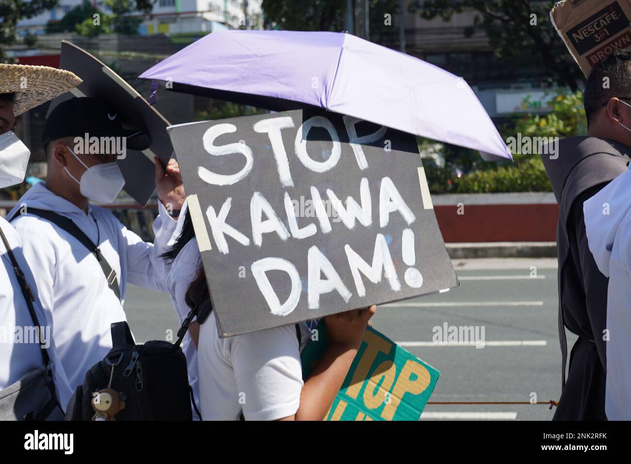 Quezon City, Philippines. 23rh February, 2023. Around 300 indigenous people (IP) belonging to Dumagat-Remontado tribe, together with environmental groups and advocates culminates their 150 kilometers “Alay Lakad Laban sa Kaliwa Dam” (Sacrifice Walk Against the Construction of Kaliwa Dam) going to Malacanang Palace on February 23, 2023. The nine-day sacrificial walk is portraying their opposition on the construction of the New Centennial Water Source–Kaliwa Dam Project (NWCP-KDP), in the borders of Rizal and Quezon Province. The mega-dam project will be submerging almost hundred hectares of anc Stock Photo