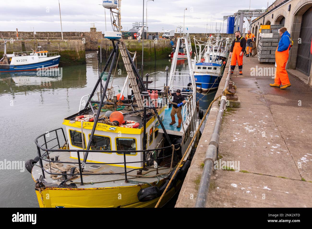 PITTENWEEM HARBOUR, SCOTLAND, EUROPE - Commercial fishermen in fishing village on the east coast of Scotland. Stock Photo