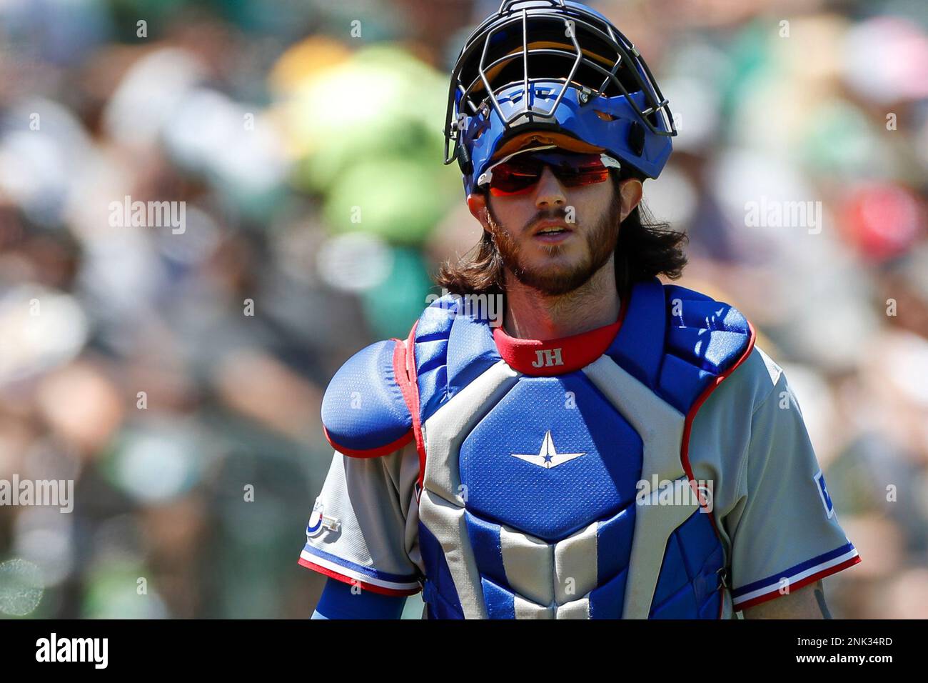 OAKLAND, CA - MAY 29: Texas Rangers catcher Jonah Heim (28) looks on during  a regular season game between the Oakland Athletics and Texas Rangers on  May 29, 2022, at RingCentral Coliseum