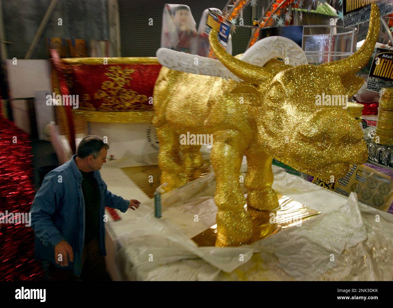 Master float builder Dave Thomas cleans up a float featuring the King ...