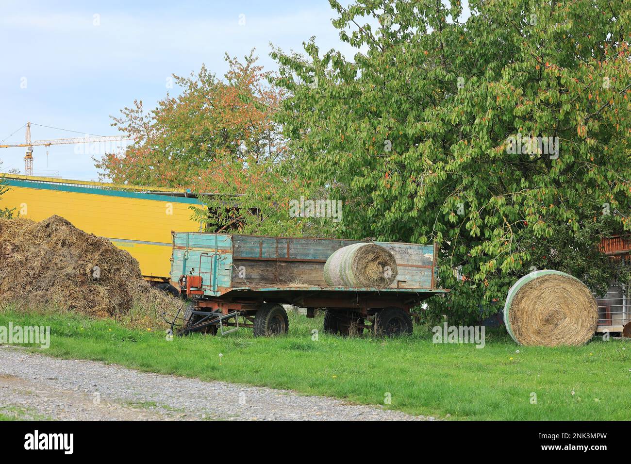 Trailer for transporting hay bales in a meadow Stock Photo