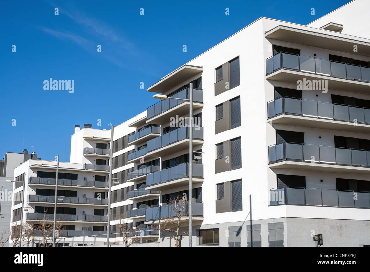 New white apartment building with balconies seen in Barcelona, Spain Stock Photo
