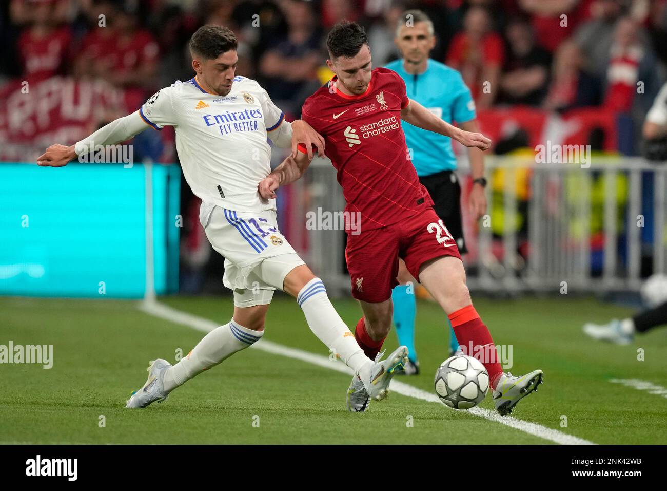 Liverpool's Andrew Robertson heads the ball during the Champions League  final soccer match between Liverpool and Real Madrid at the Stade de France  in Saint Denis near Paris, Saturday, May 28, 2022. (