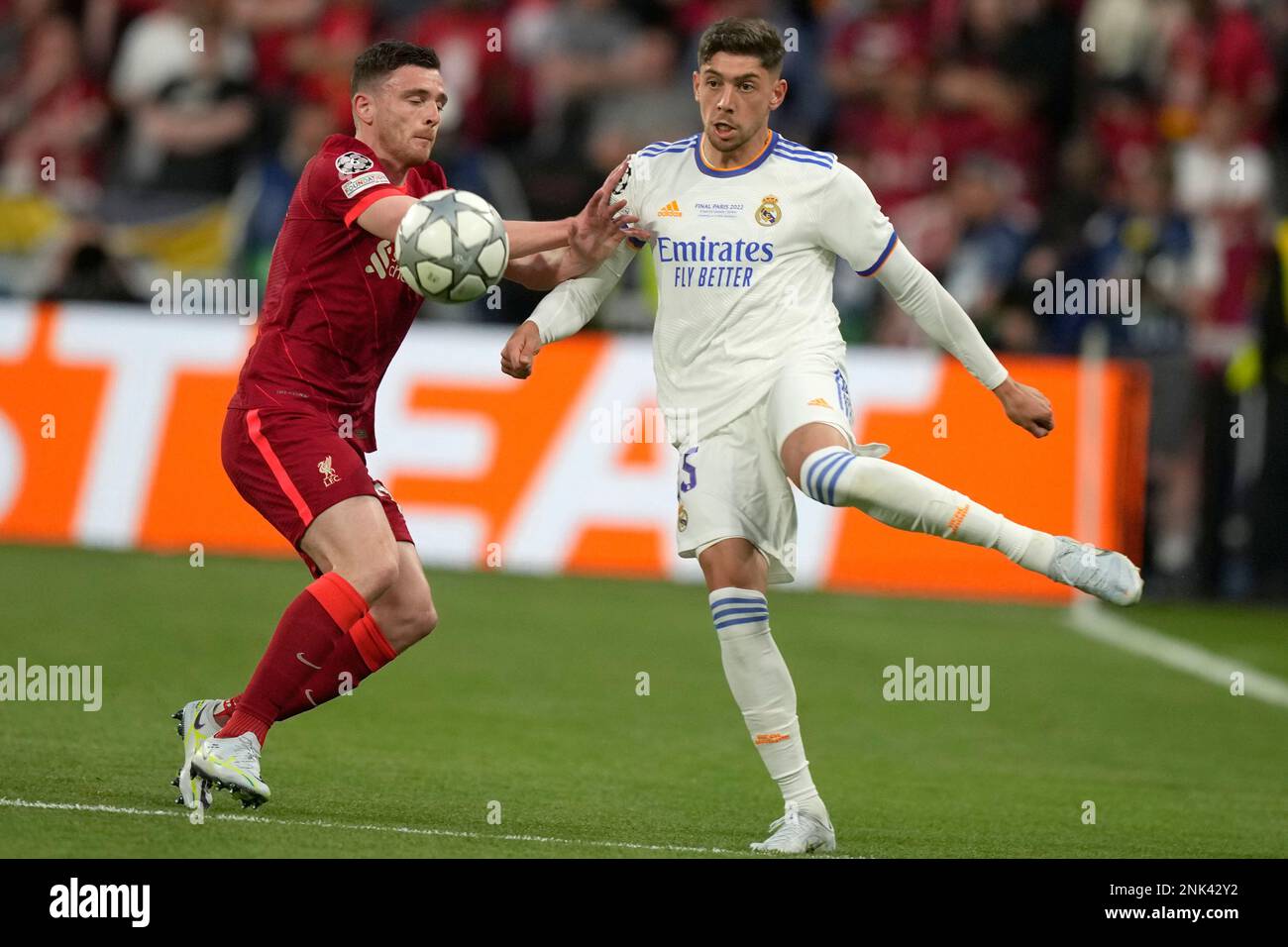 Liverpool's Andrew Robertson heads the ball during the Champions League  final soccer match between Liverpool and Real Madrid at the Stade de France  in Saint Denis near Paris, Saturday, May 28, 2022. (