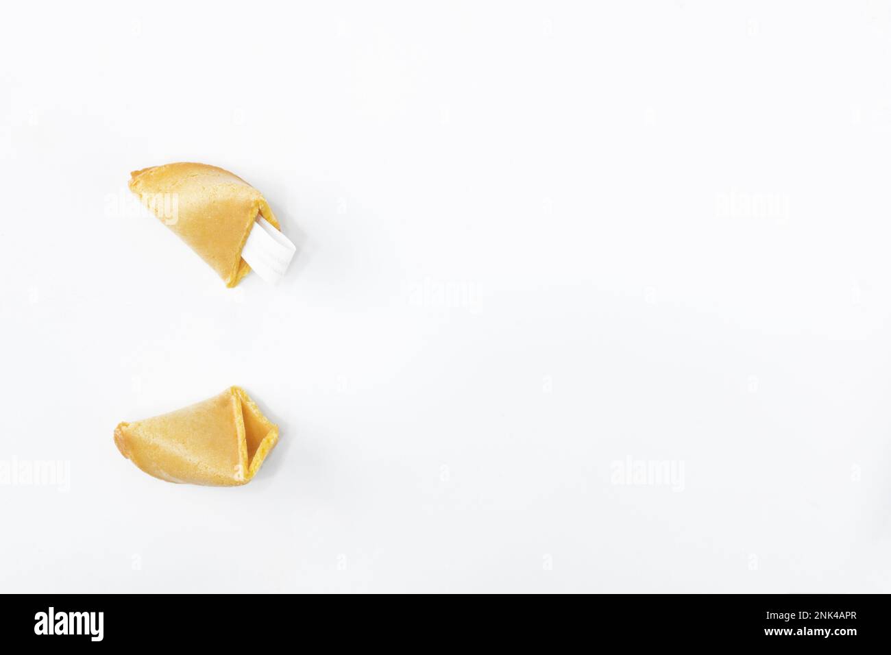 Fortune cookie. Broken fortune cookies with blank slip isolated on