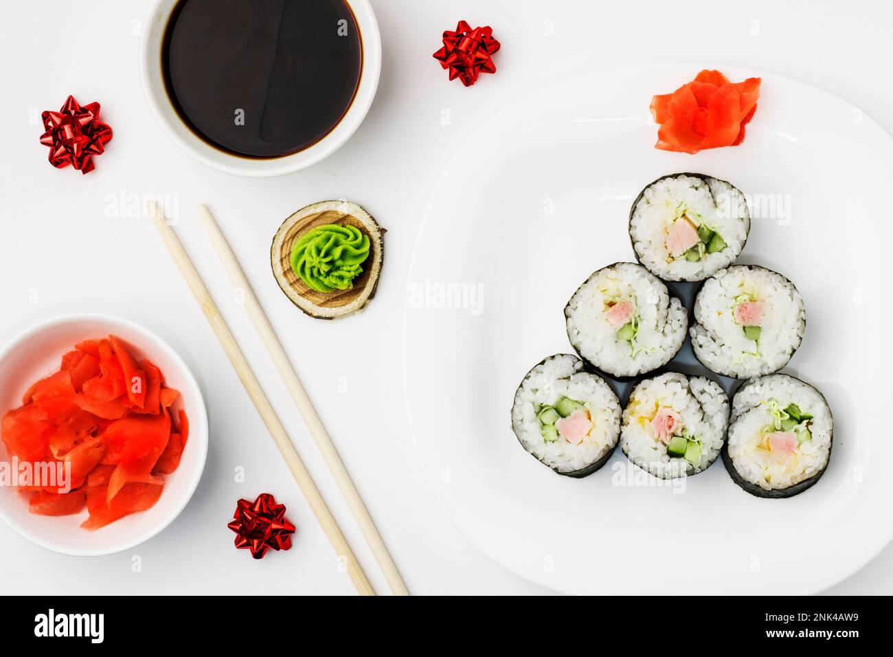 Funny edible Christmas tree, from sushi rolls, on white background. Creative idea for japanese restaurant. The concept of food for the new year and ch Stock Photo