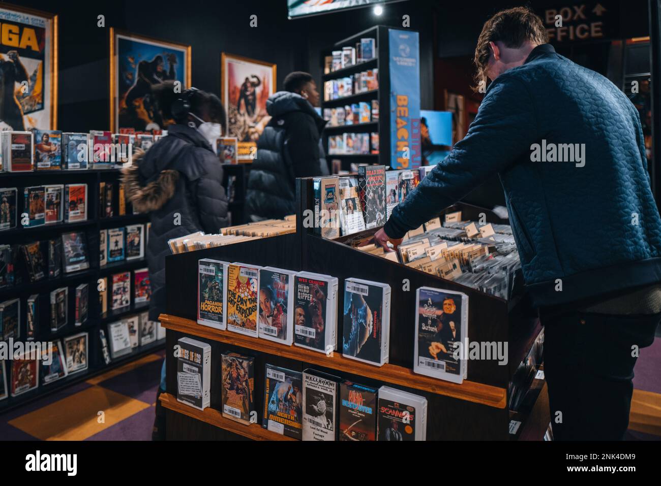 New York, USA - November 25, 2022: Visitors browsing free DVD and VHS rentals at Kim's Video in Alamo Drafthouse Lower Manhattan. Kim’s Video is back Stock Photo