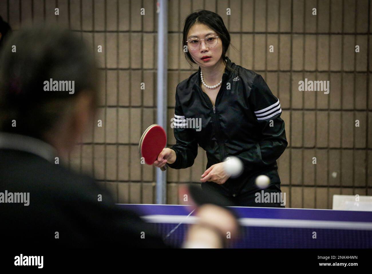Erin Luan, 29, plays ping pong at the Willy "Woo Woo" Wong Recreation  Center during the annual Chinatown ping-pong festival in San Francisco,  Calif., on Sunday, Aug. 20, 2017. (Gabrielle Lurie/San Francisco