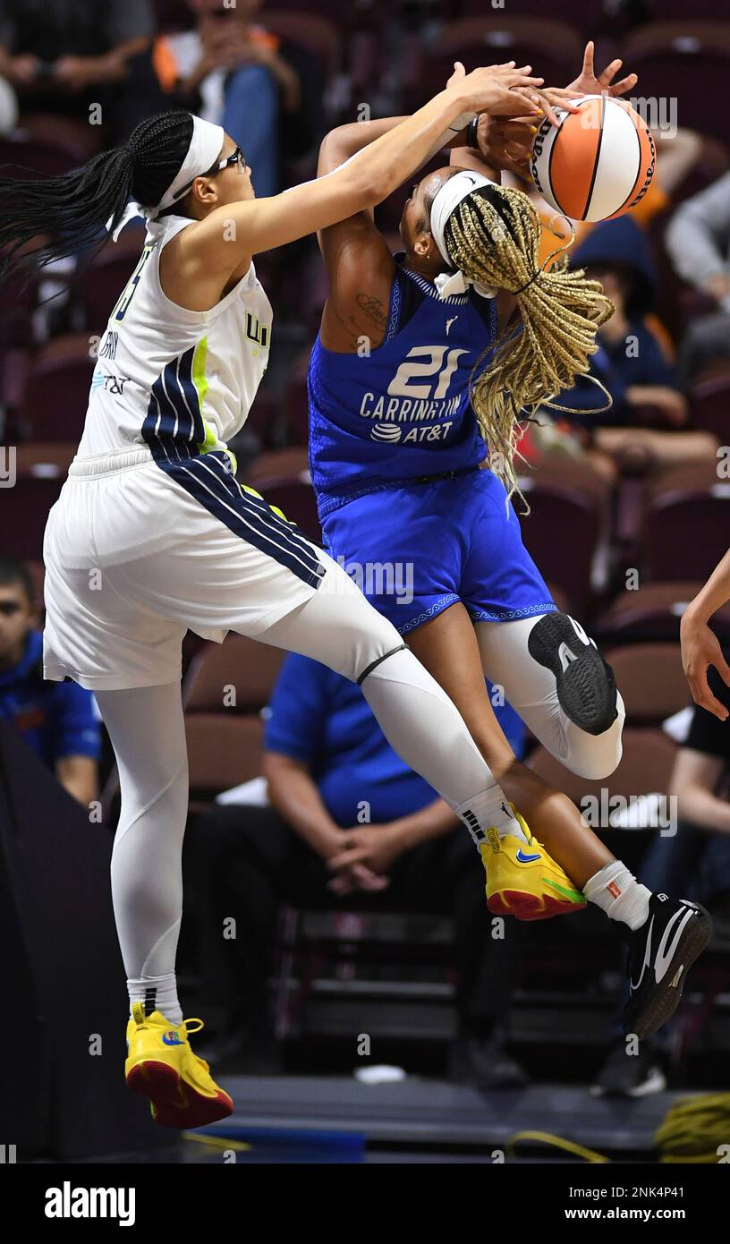 Connecticut Sun forward DiJonai Carrington (21) shoots as Atlanta