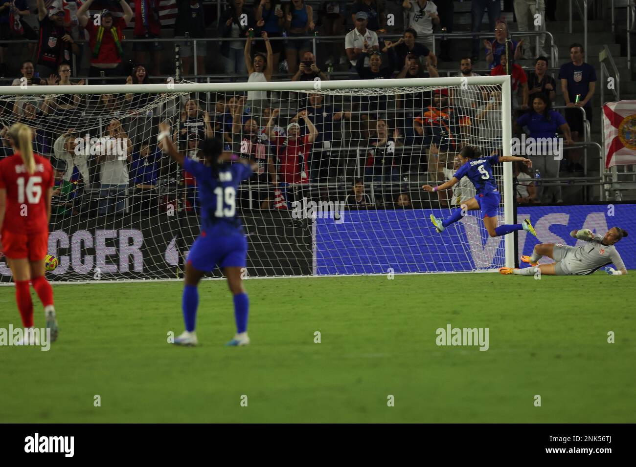 United States Women’s National Team forward Mallory Swanson (9) scores her second goal past Canada Women’s National Team goalie Kailen Sheridan (1) at Exploria Stadium on February 16, 2023 in Orlando, FL.  United States defeated Canada 2-0 in the 2023 SheBelieves Cup match (Credit: Paul Fong/Image of Sport) Stock Photo