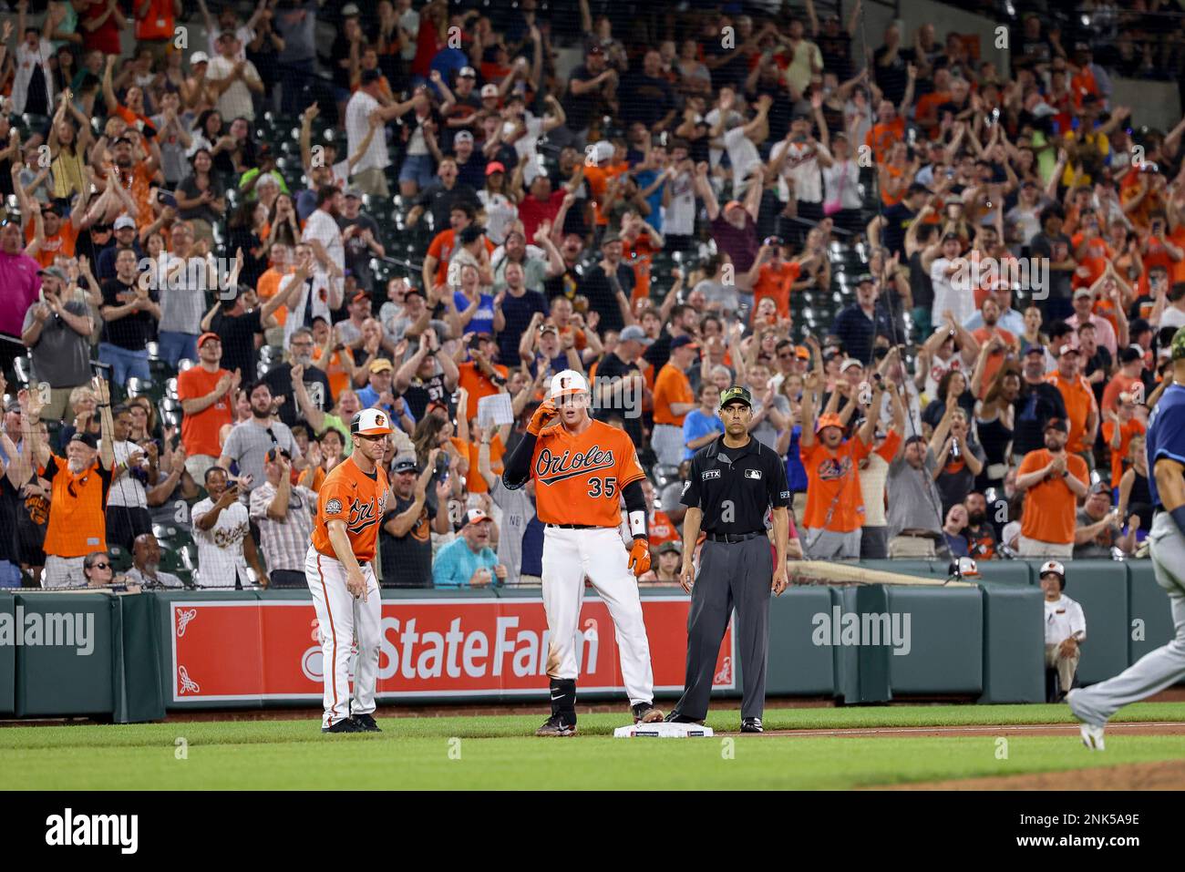 BALTIMORE, MD - MAY 21: Fans cheer as Adley Rutschman (35) of the Baltimore  Orioles has his first MLB hit, which is a triple during a game against the  Tampa Bay Rays