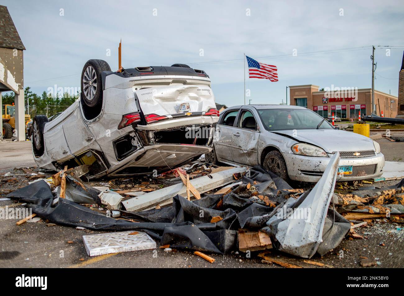Two heavilydamaged vehicles rest in the Hobby Lobby parking lot amid the damage and aftermath