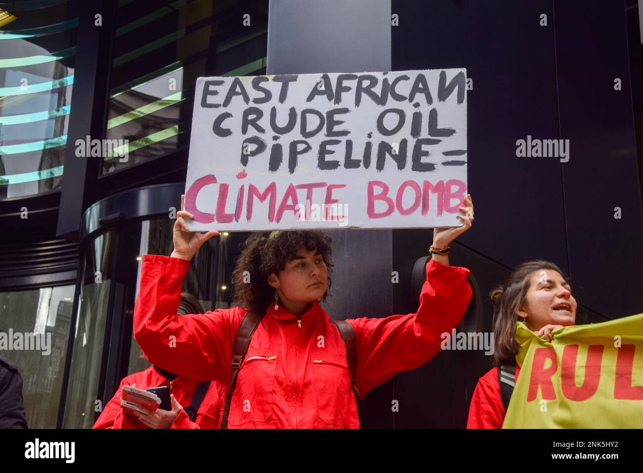 London, UK. 23rd Feb, 2023. A protester holds an anti-EACOP placard during the demonstration outside Talbot Underwriting. Climate activists staged a protest against the East African Crude Oil Pipeline (EACOP) outside Talbot and Cincinnati Insurance offices in the City of London, calling on the companies to refuse insurance for the project. Credit: SOPA Images Limited/Alamy Live News Stock Photo