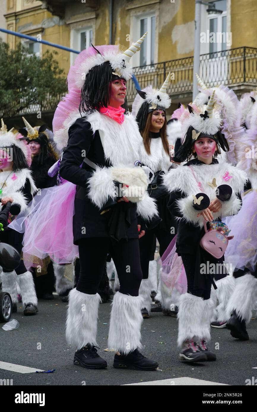 Rijeka, Croatia, 19th February, 2023. Unicorn costumed cheerful woman and girls at the carnival parade Stock Photo