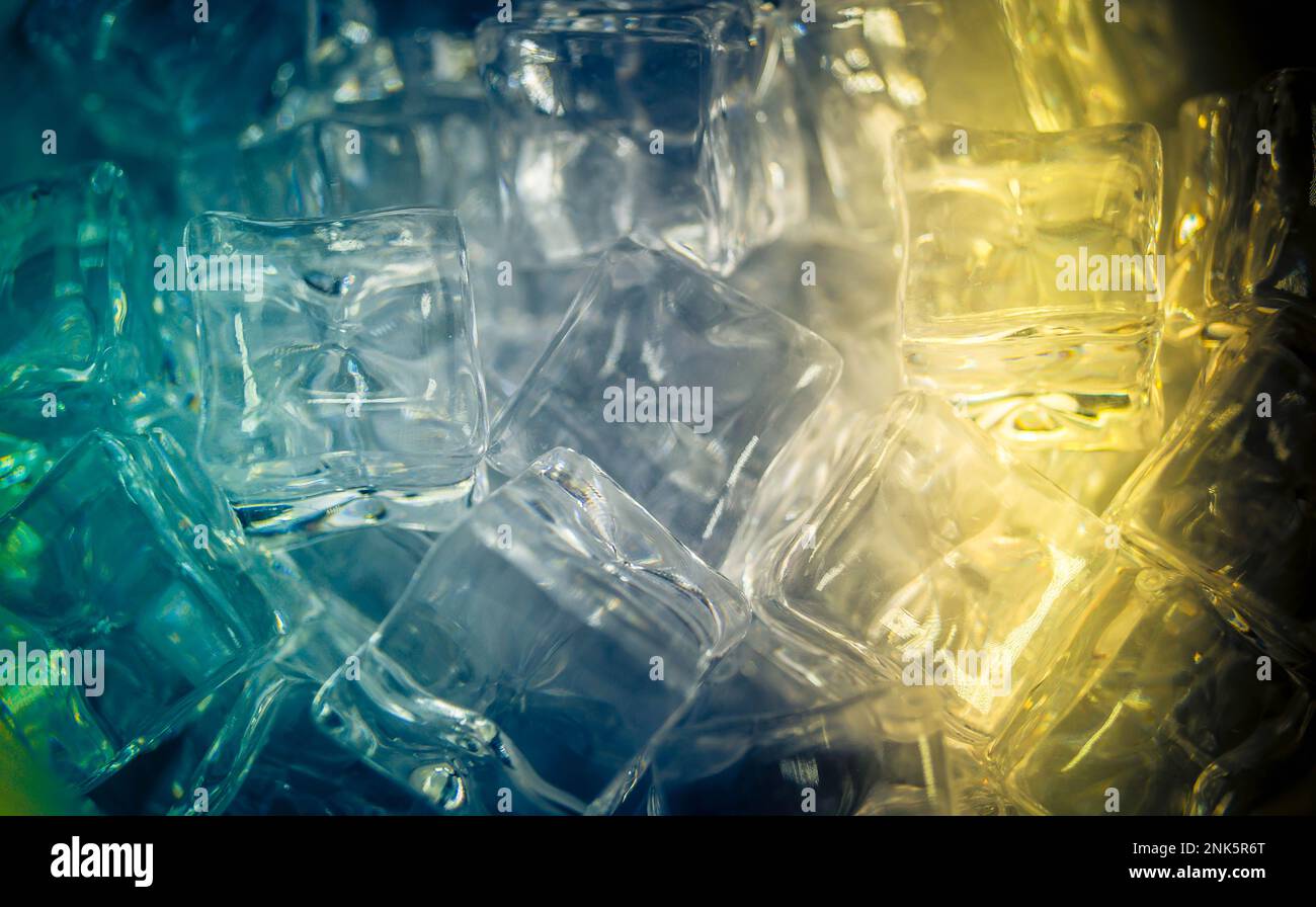 diffuse light shines on a handful of ice cubes Stock Photo - Alamy