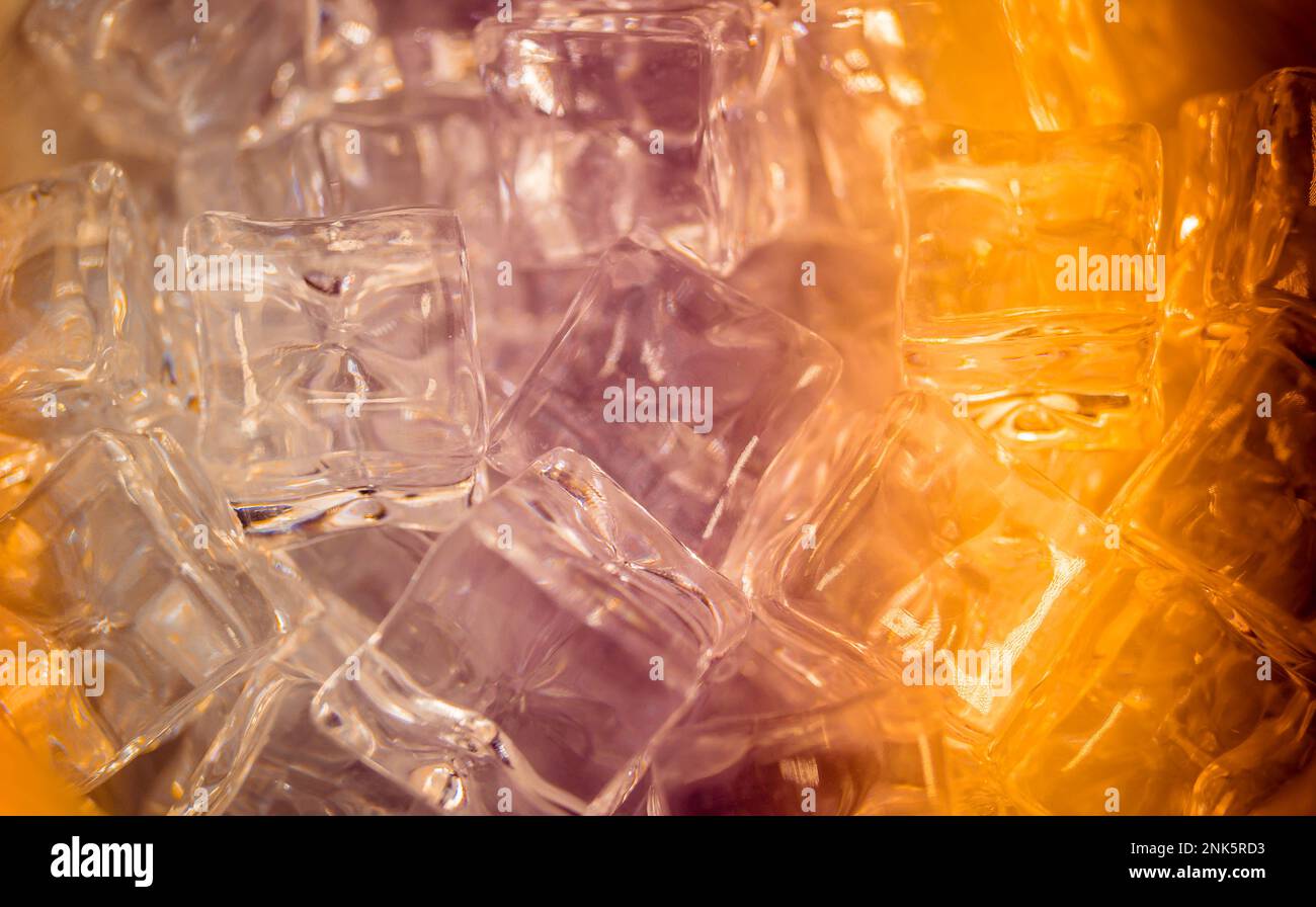 diffuse light shines on a handful of ice cubes Stock Photo - Alamy