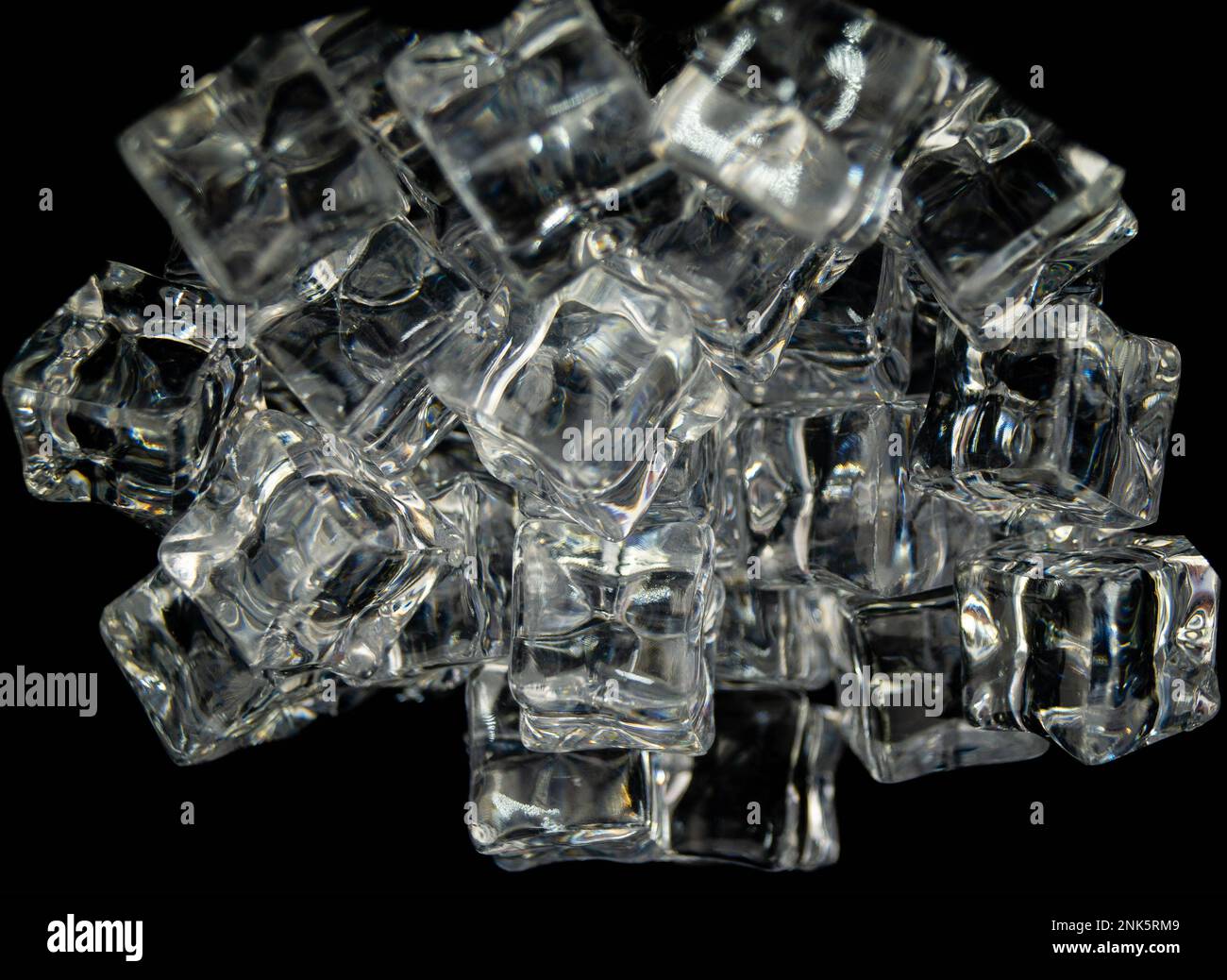 diffuse light shines on a handful of ice cubes Stock Photo - Alamy