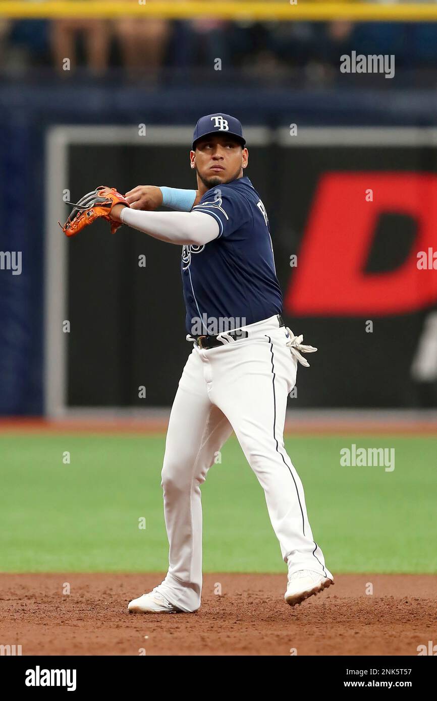 ST. PETERSBURG, FL - MAY 18: Tampa Bay Rays infielder Isaac Paredes (17)  throws the ball over to first base during the MLB regular season game  between the Detroit Tigers and the