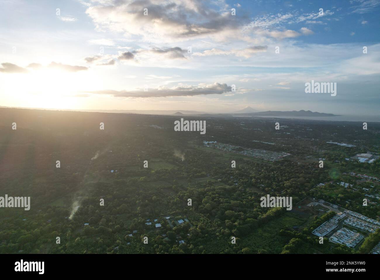 Sunset over green Managua landscape aerial drone view Stock Photo