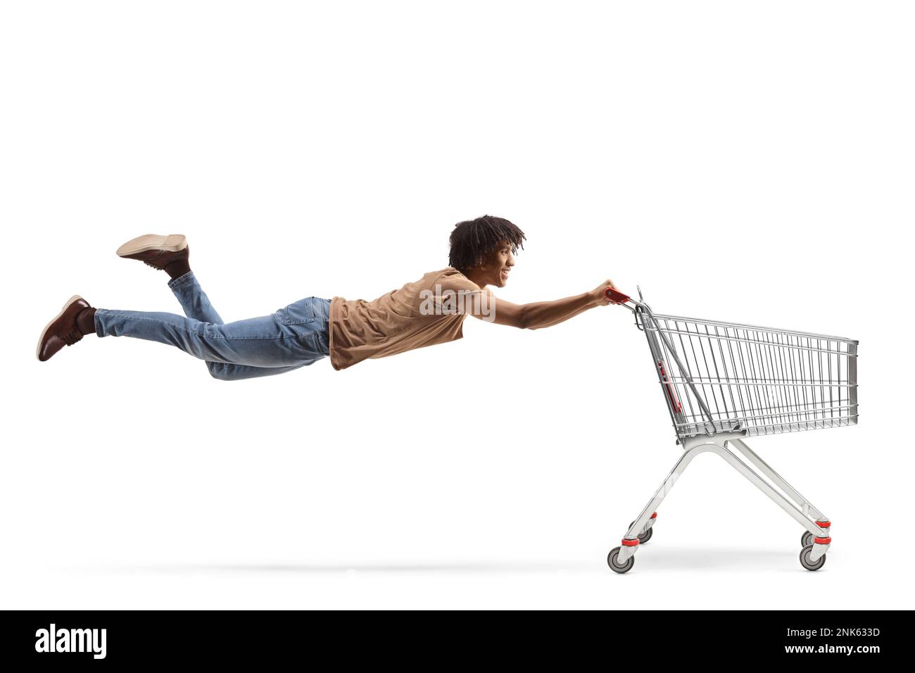 African american guy flying and holding a shopping cart isolated on