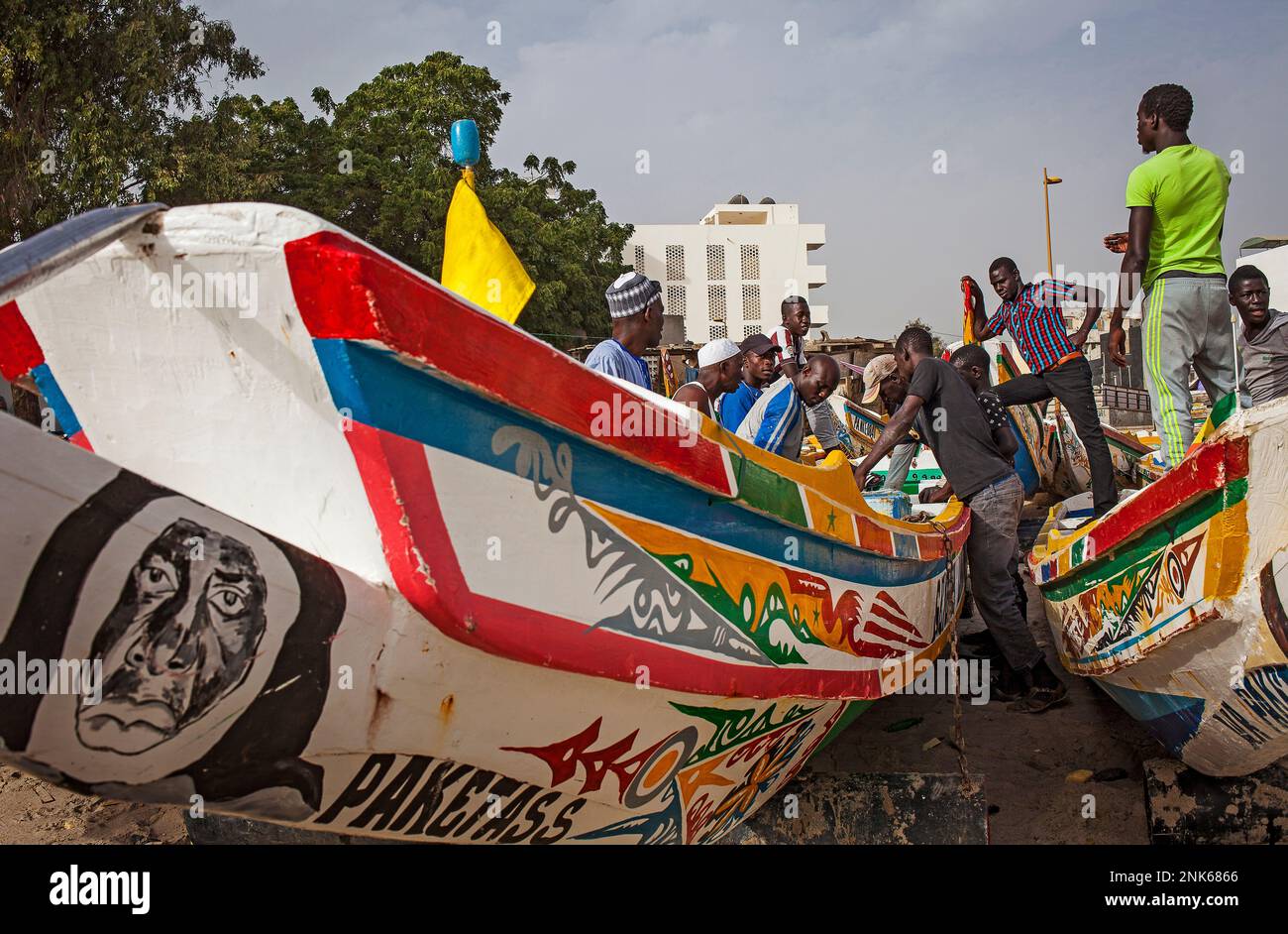 Fishermen selling the catch.At the fish market beach in soumbedioune, Dakar, Senegal Stock Photo