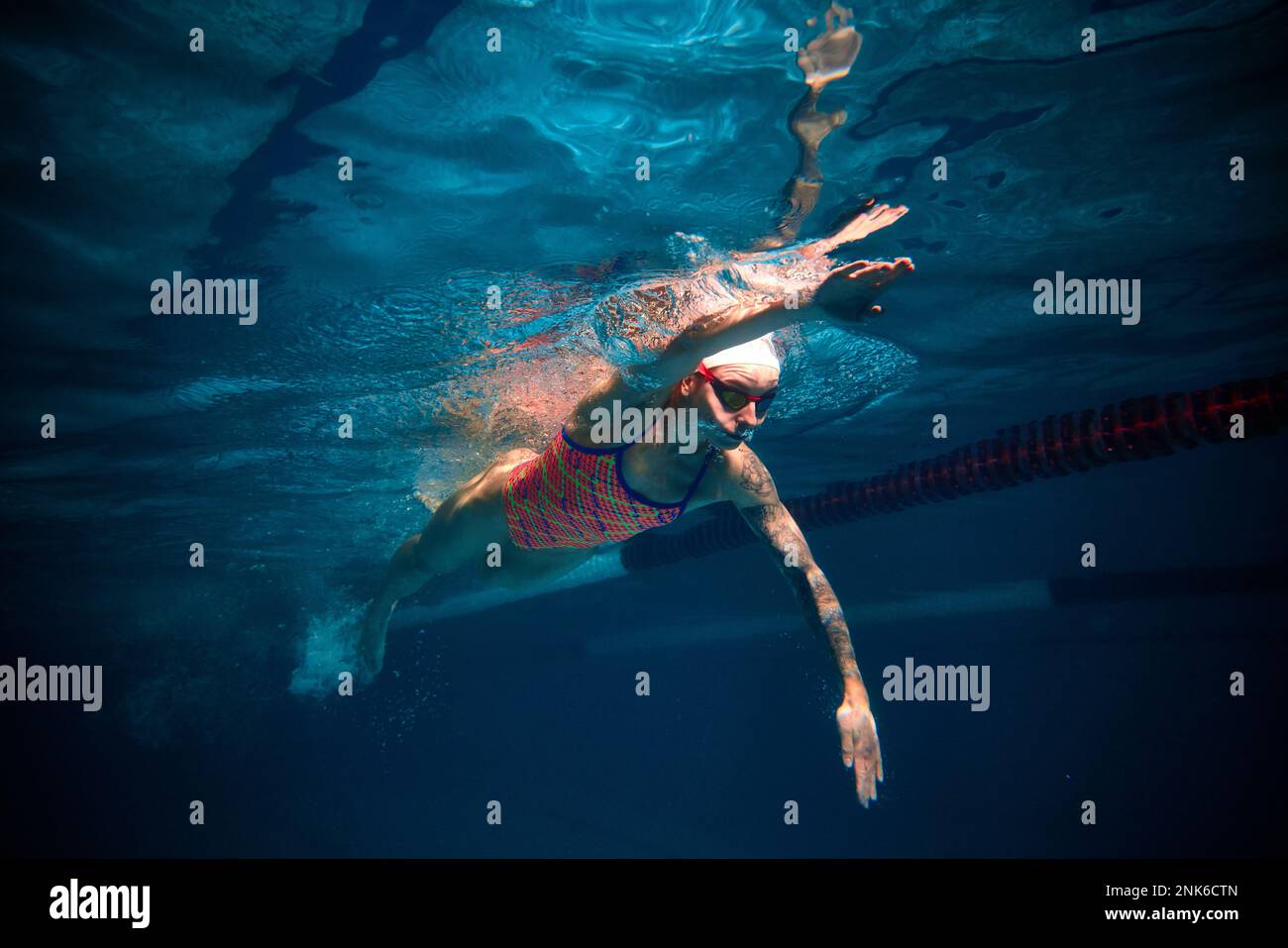 Moving fast. Competitive woman, professional female swimmer training in