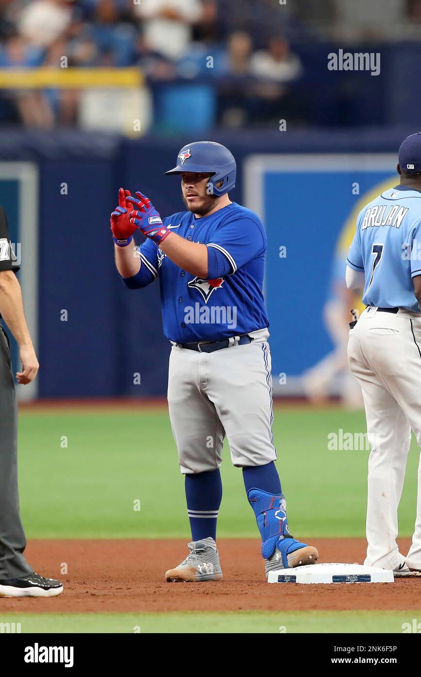 ST. PETERSBURG, FL - MAY 15: Toronto Blue Jays catcher Alejandro Kirk (30)  celebrates his double with his teammates in the dugout during the MLB  regular season game between the Toronto Blue