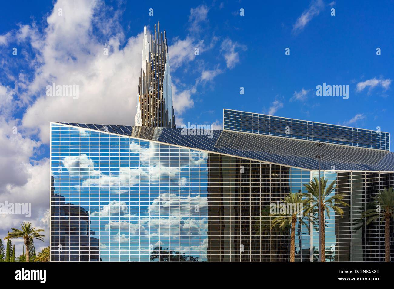 Garden Grove, CA, USA – November 2, 2022: Clouds reflect off the building of Christ Cathedral, formerly Crystal Cathedral, in Garden Grove, California Stock Photo