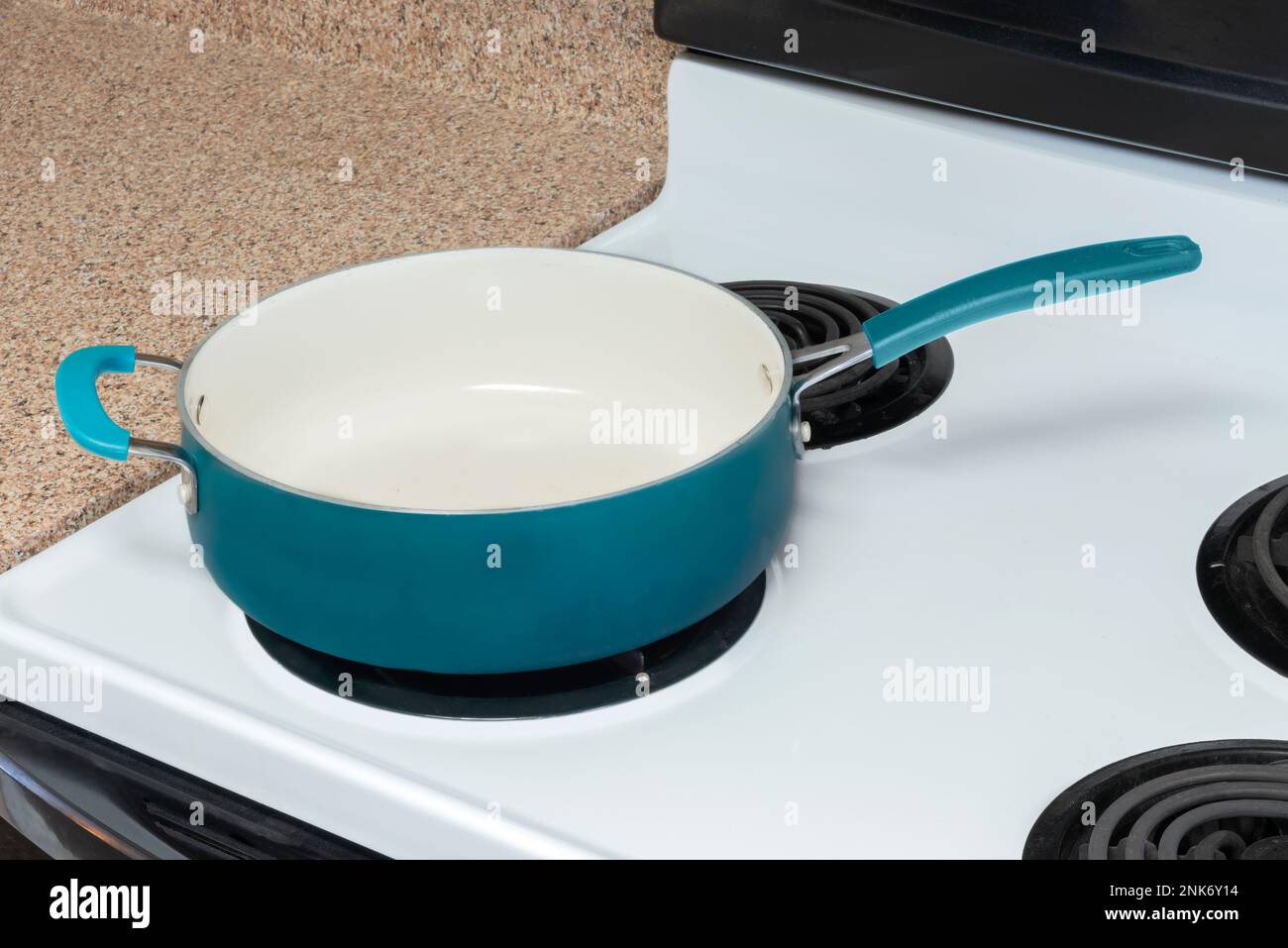 https://c8.alamy.com/comp/2NK6Y14/horizontal-shot-of-an-empty-blue-pot-on-a-stove-top-with-copy-space-2NK6Y14.jpg
