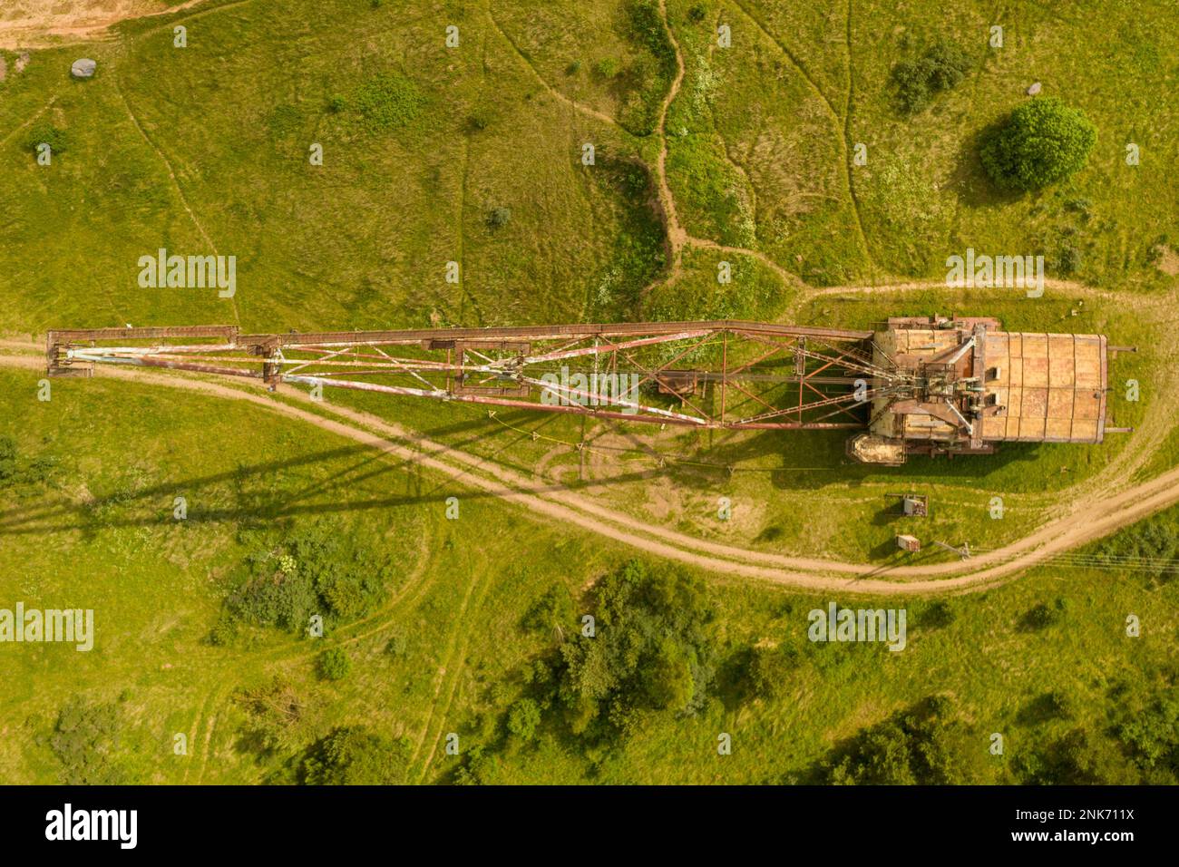 Drone photography of old abandoned excavator in quarry during summer day Stock Photo