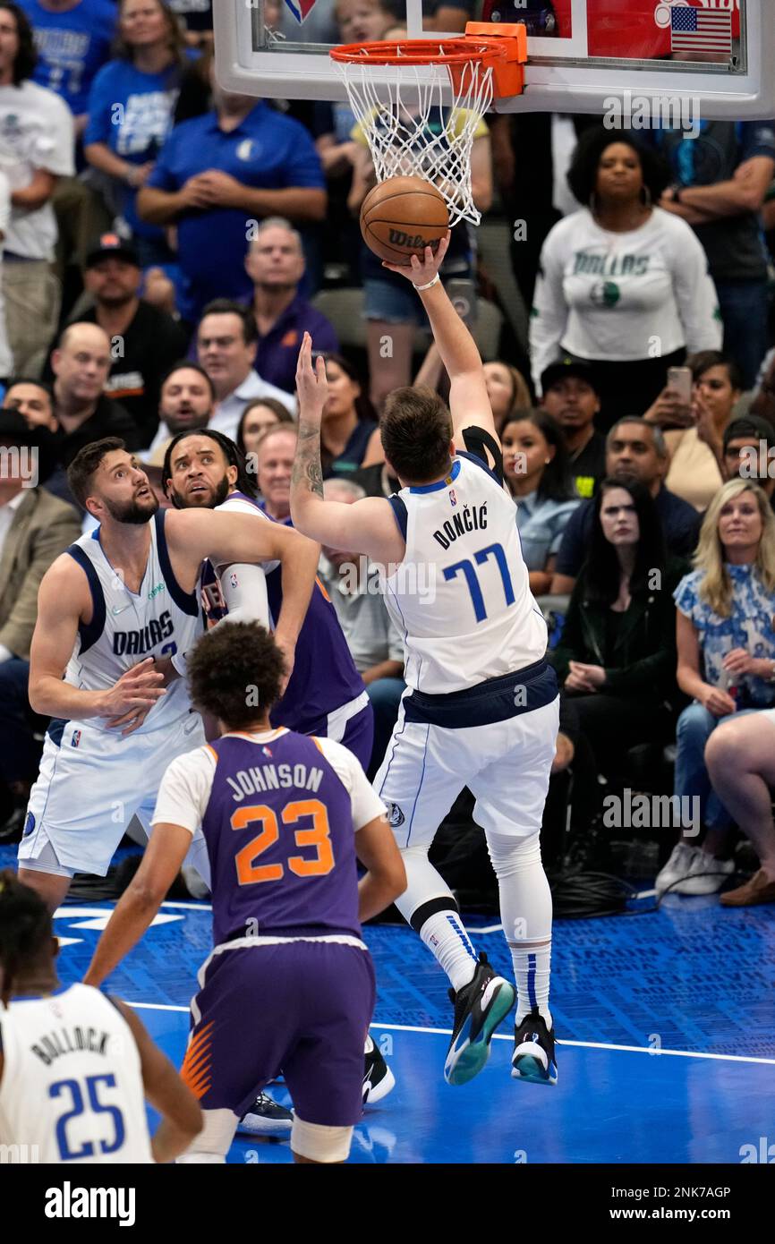 Dallas Mavericks guard Luka Doncic (77) takes a shot attempt at the rim ...