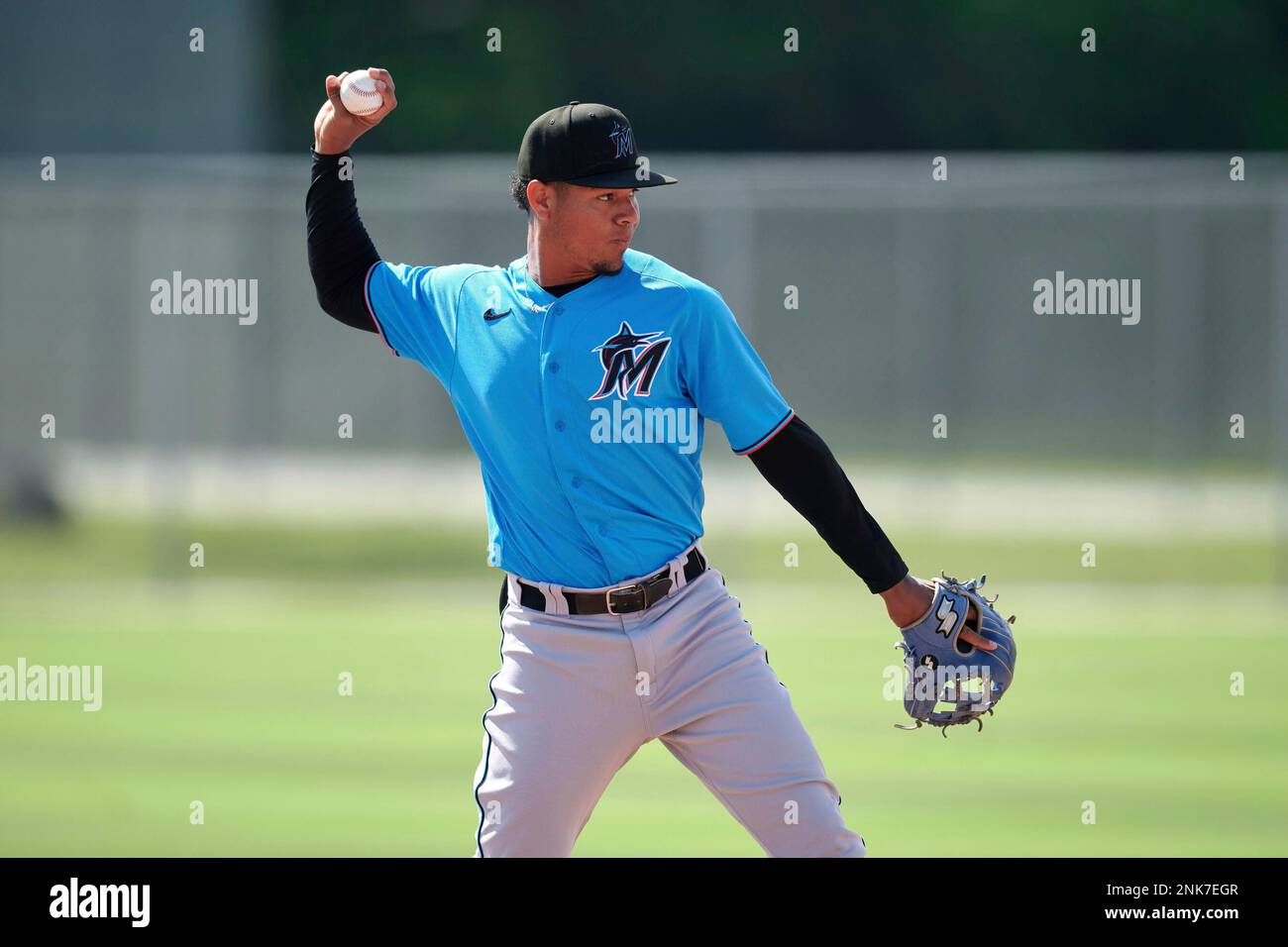 Miami Marlins shortstop Carlos Santiago (94) throwing during a