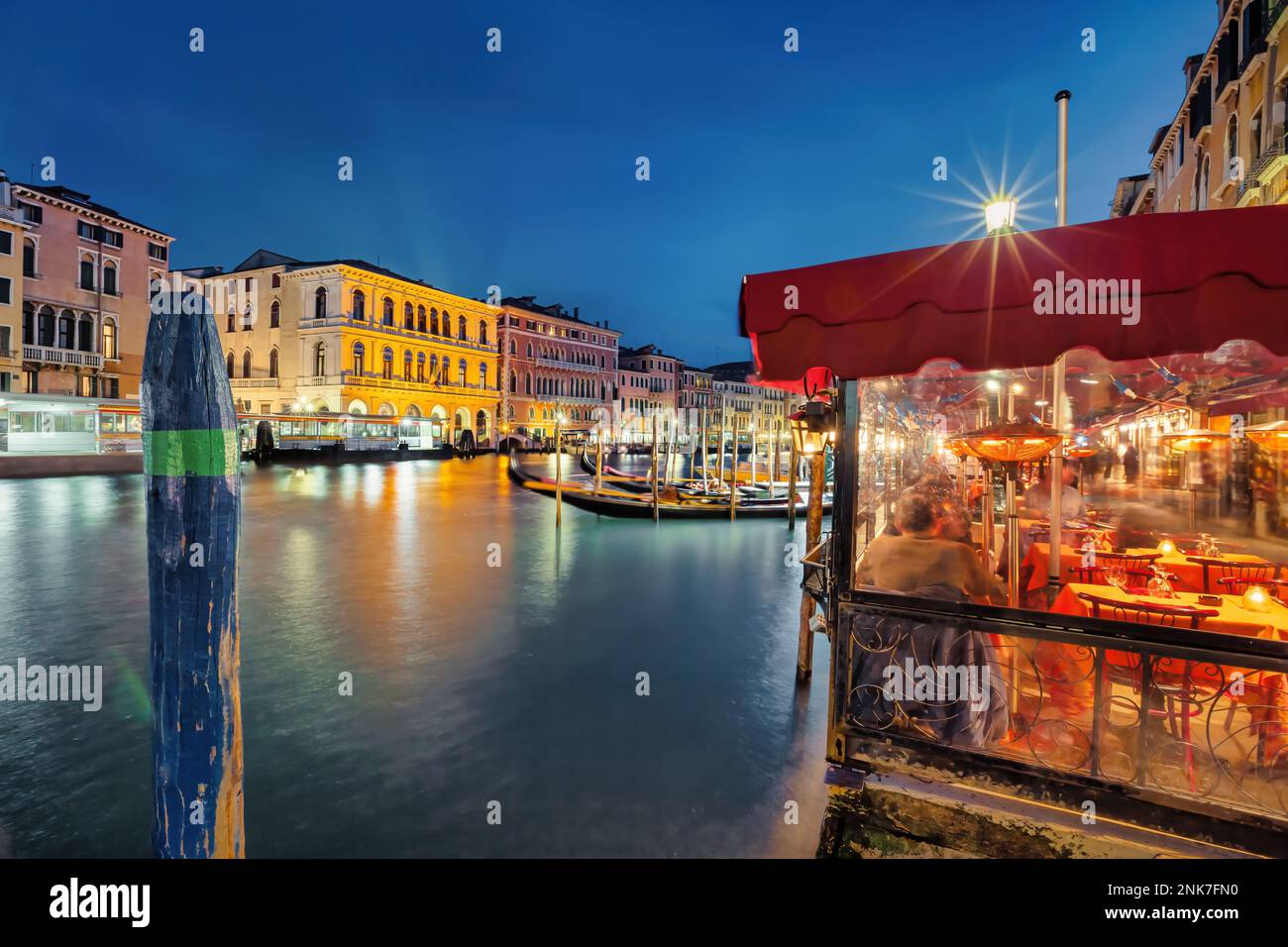 Restaurant patio on the Grand Canal in Venice Italy Stock Photo