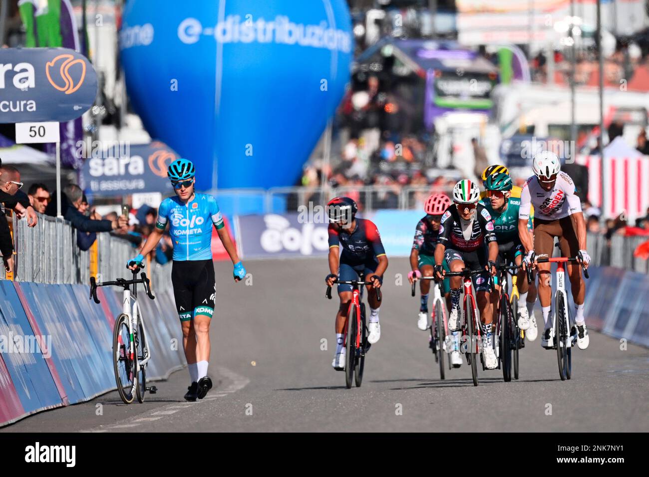 Hungary's Erik Fetter, left, walks with his bicycle at the finish line of  the fourth stage of the Giro D'Italia cycling race from Avola to  Etna-Nicolosi, Italy, Tuesday, May 10, 2022. (Massimo