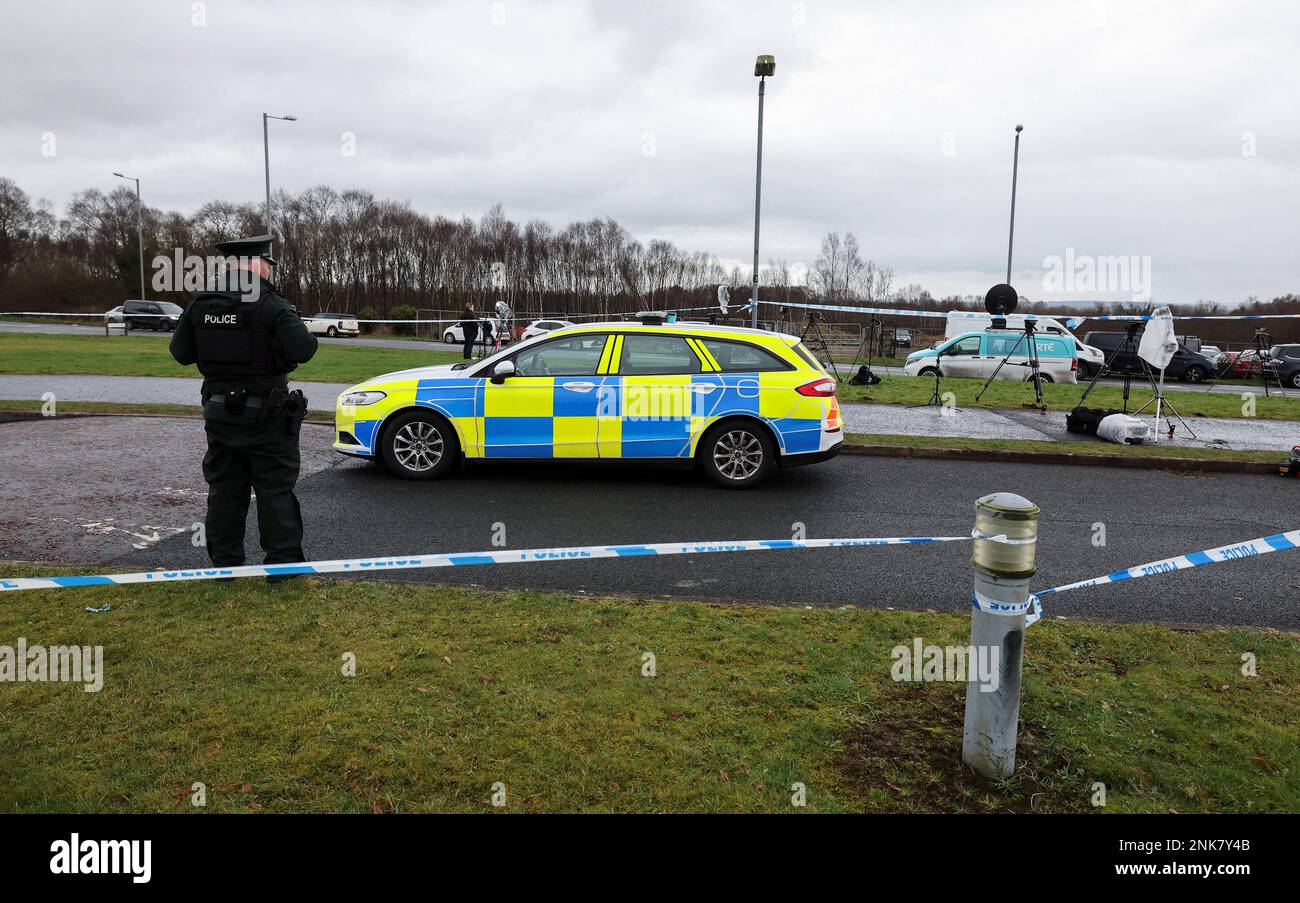 A police officer stands guard at the Youth Sport Omagh sports complex