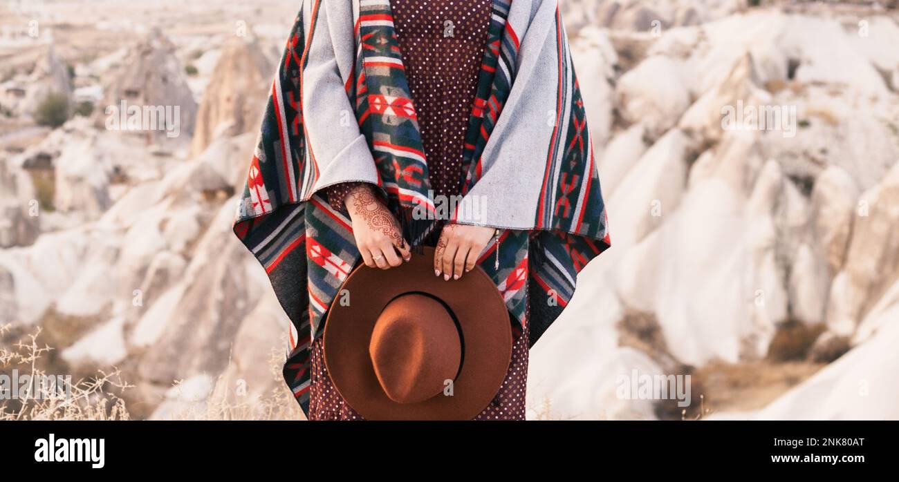 Traditional american painting poncho, indian mehndi on hands, brown hat and  dark red dress. Stylish boho chic lifestyle female clothing. Close up, cop  Stock Photo - Alamy