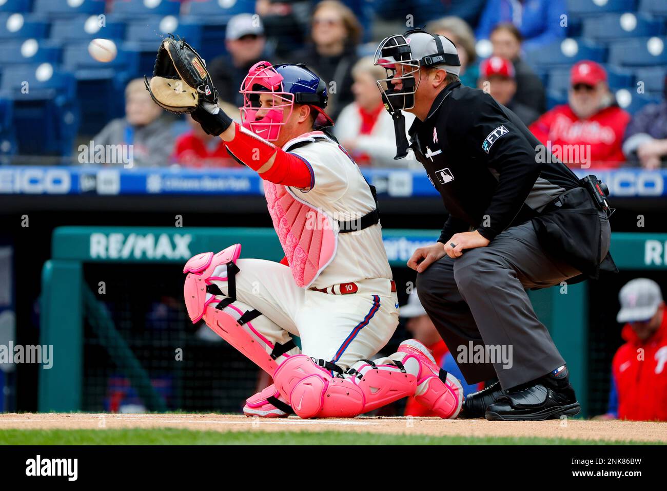 PHILADELPHIA, PA - MAY 08: Philadelphia Phillies catcher J.T. Realmuto (10)  in his pink Nike catchers gear on Mothers Day during the Major League  Baseball game between the Philadelphia Phillies and the