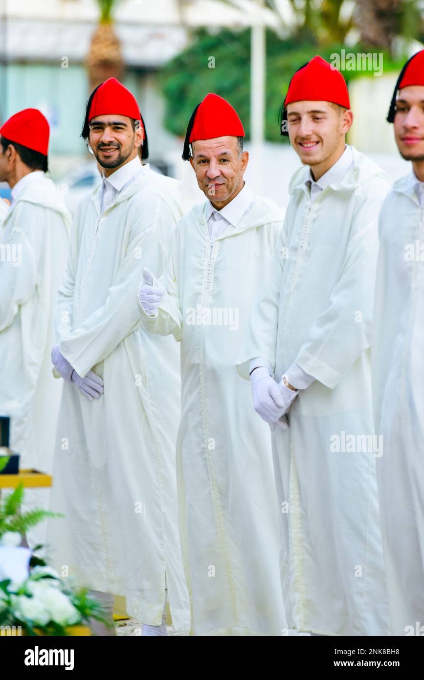 Moroccan men wear traditional clothes. Men working at the wedding