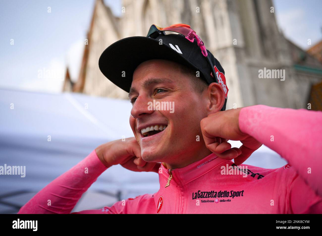 Dutch rider Mathieu van der Poel smiles as he wears the pink jersey of ...